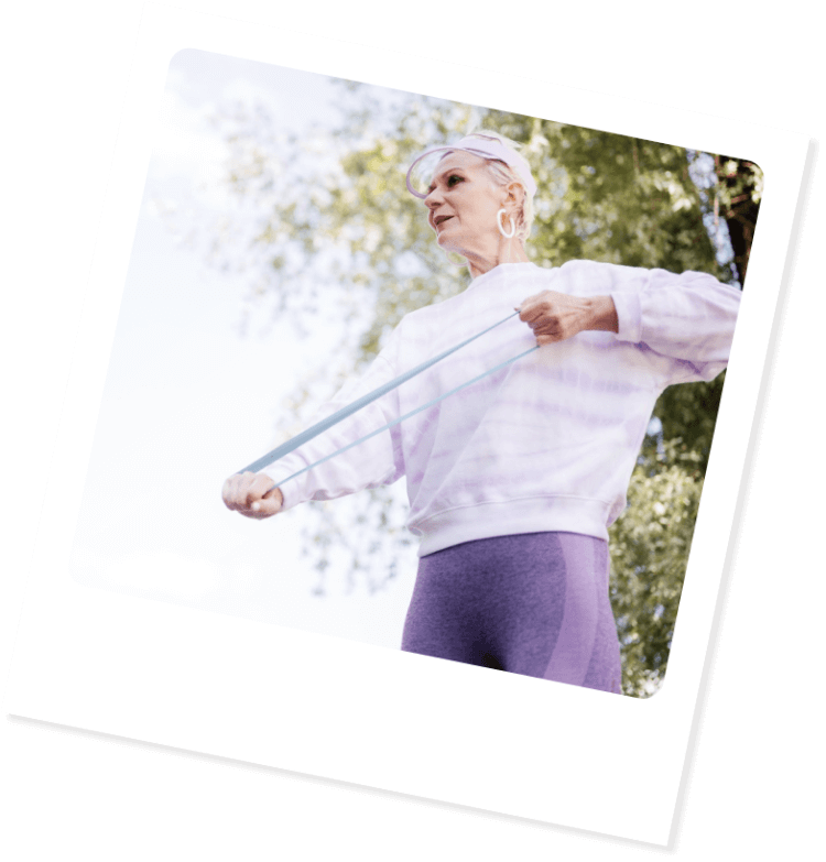 Senior woman stretching with resistance band
